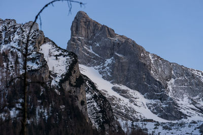 Scenic view of snowcapped mountains against clear sky