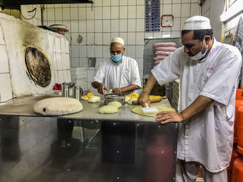 People working in kitchen