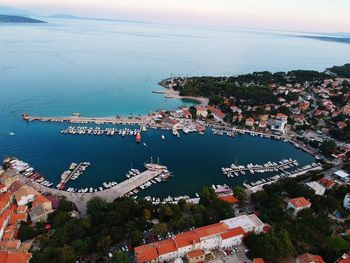 High angle view of sea and buildings against sky