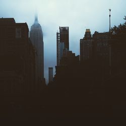 Modern buildings in city against sky