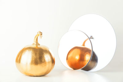 Close-up of oranges against white background