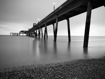 Pier over sea against sky