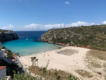 High angle view of swimming pool by sea against sky