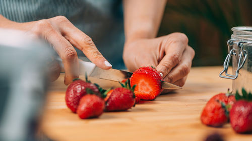 Fruit preservation at home. woman preparing fruits for canning at home.