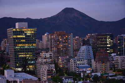 Illuminated buildings in city at night