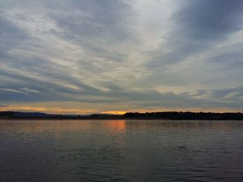 View of calm sea against cloudy sky