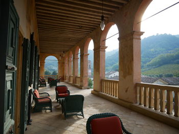 Empty chairs and tables in building