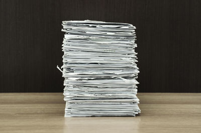 Close-up of stacked documents at desk
