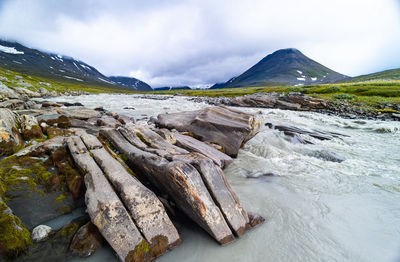 A wild, turbulent mountain river in the sarek national park, sweden. 