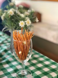 Close-up of flower vase on table