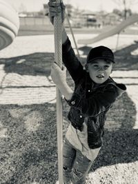 Young boy playing outdoors at the park on a sunny beautiful day