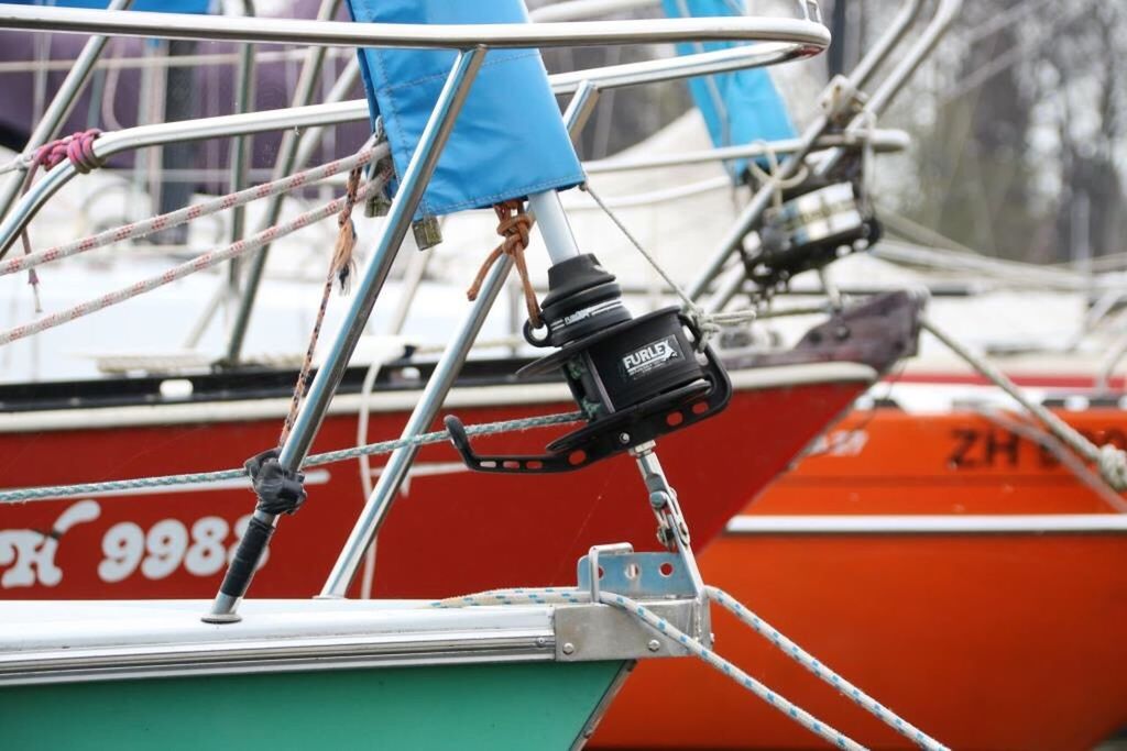 CLOSE-UP OF NAUTICAL VESSEL MOORED ON BOAT