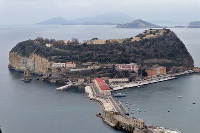 High angle view of sea and city against sky