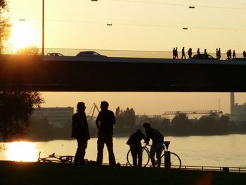 Silhouette people at sunset