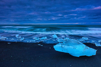 Scenic view of sea against sky during winter