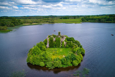 High angle view of plants by lake against sky