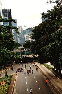 People on city street against sky