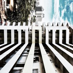 Low angle view of buildings against cloudy sky