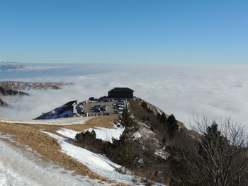 Scenic view of mountains against clear sky during winter