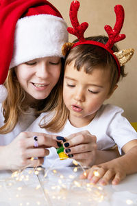 Portrait of girl playing with toys at home