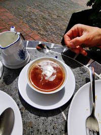 High angle view of person having food on table