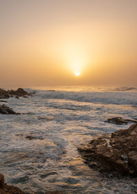 Scenic view of sea against sky during sunset