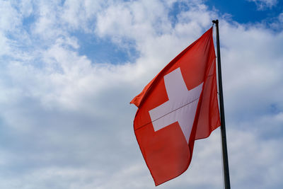 Low angle view of flag against sky