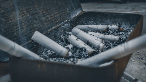 Close-up of cigarette smoking on table