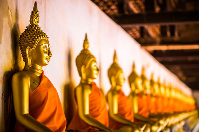 Statue of buddha against building