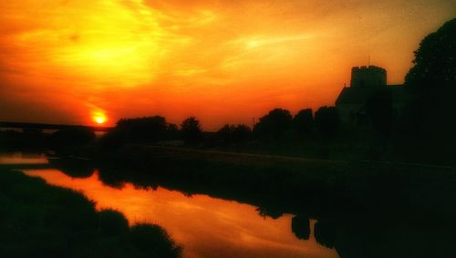 Scenic view of lake at sunset