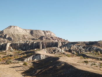 Scenic view of rocky mountains against clear blue sky