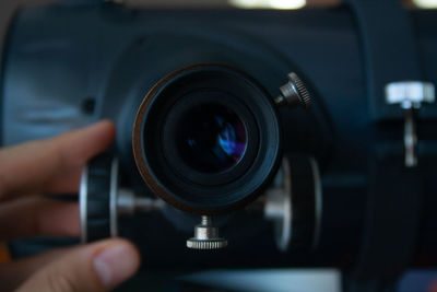 Close-up of hand holding camera