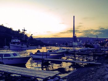 Boats moored at harbor