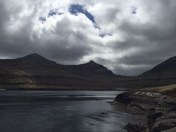 View of calm sea against cloudy sky