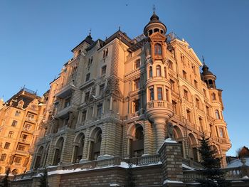 Low angle view of building against blue sky