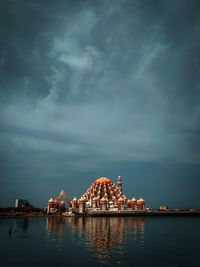 Illuminated city at waterfront