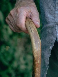 Cropped hand of man holding knife