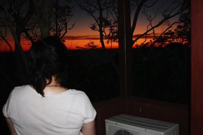 Silhouette of woman at sunset