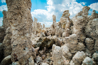 Low angle view of rock formation against sky