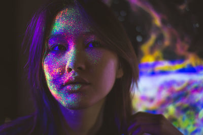 Portrait of beautiful young woman with face paint