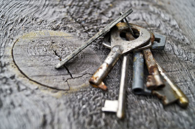 Close-up of rusty keys on table