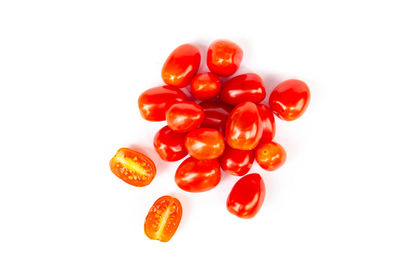 Close-up of tomatoes against white background