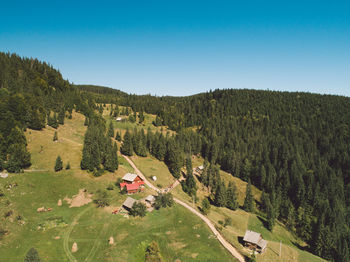 High angle view of trees on mountain against sky