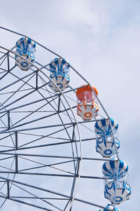 Low angle view of ferris wheel against sky