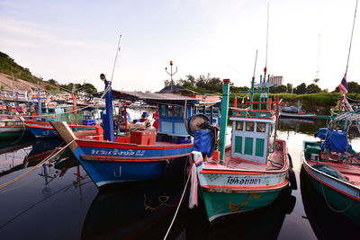 Boats moored at harbor