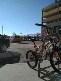 Bicycles parked on road against sky