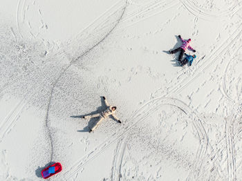 High angle view of people skiing on land