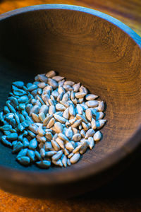 High angle view of blue candies in bowl on table