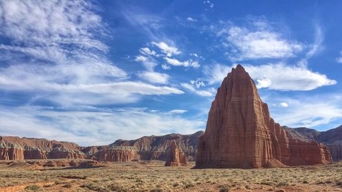 Low angle view of rock formation against sky