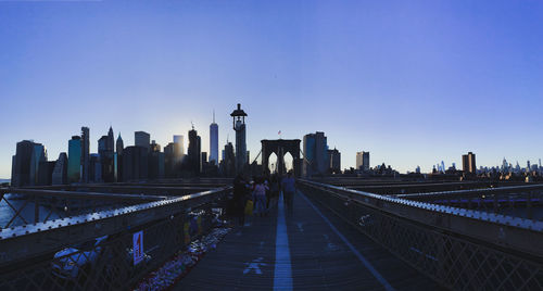 Panoramic view of buildings in city against clear sky